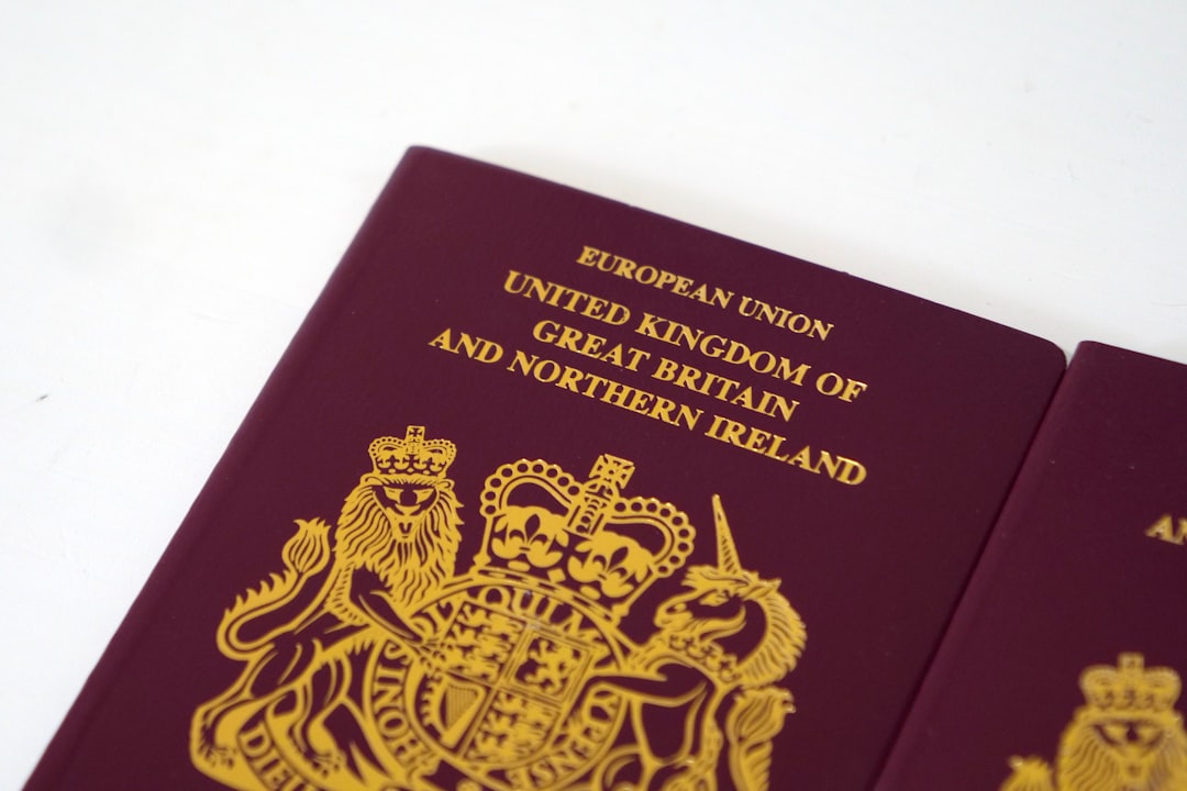 mica casp authorisation - a british passport sitting on top of a white table