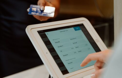 paypal buyout interest - A modern cashless payment system using a tablet and card for seamless transactions.