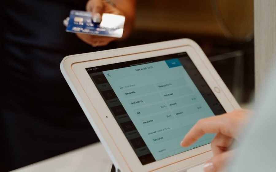 paypal buyout interest - A modern cashless payment system using a tablet and card for seamless transactions.