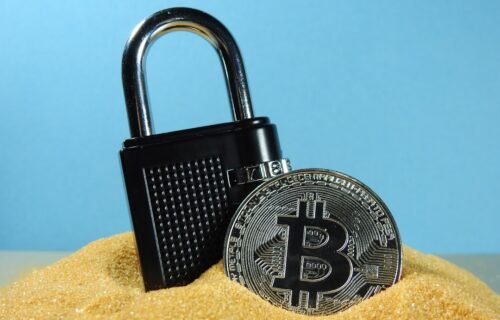 quantum-proof bitcoin - black and silver padlock on brown wooden table
