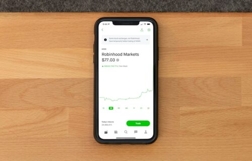 robinhood crypto ai - white samsung android smartphone on brown wooden table