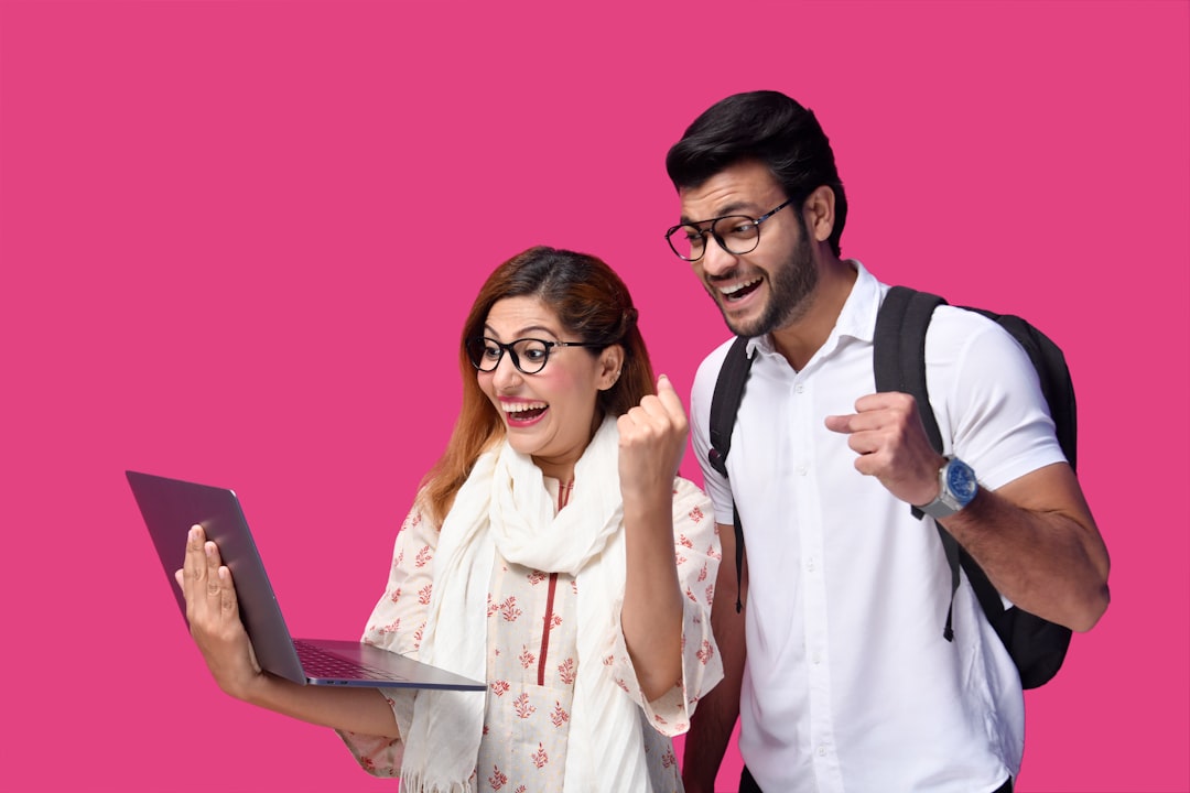 student loan changes - a man and a woman looking at a laptop