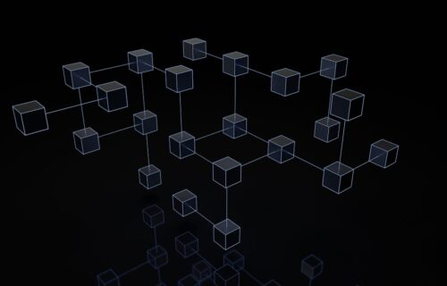 swift blockchain transactions - a black and white photo of cubes on a black background
