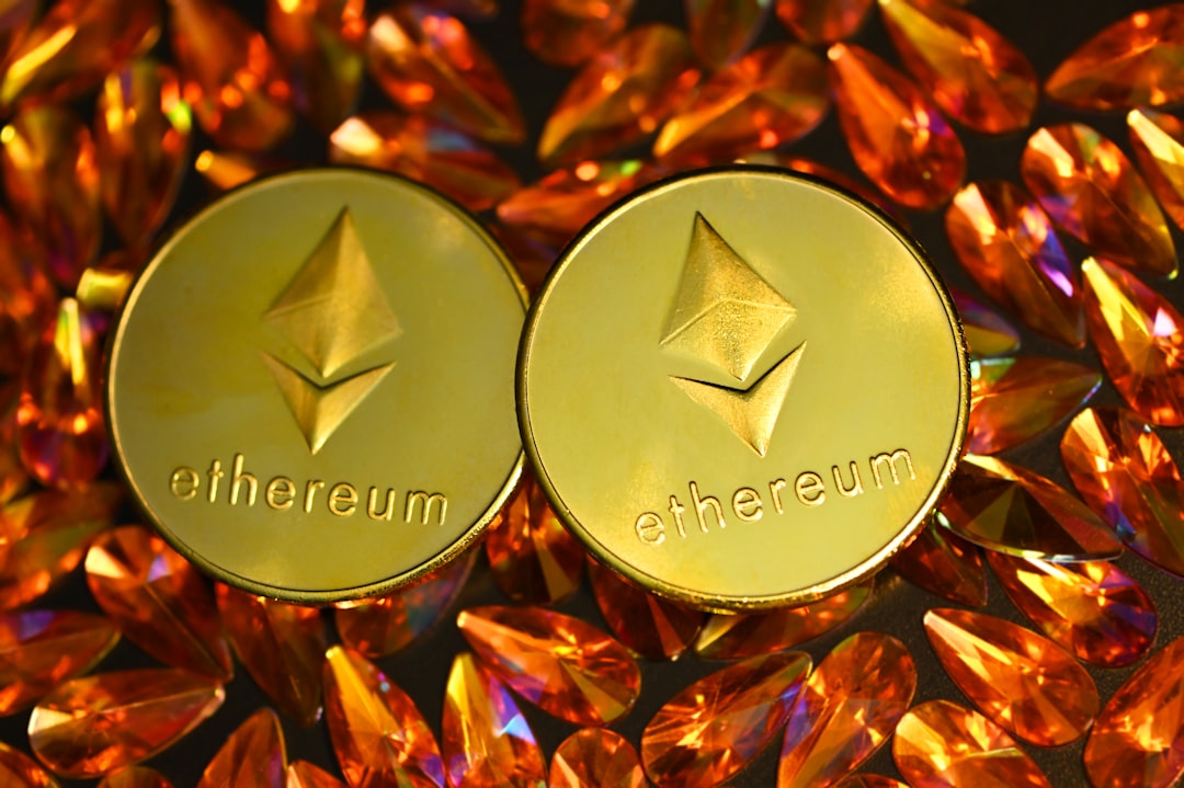 tokenized equities - two gold ethereum tokens sitting on top of a pile of crystals