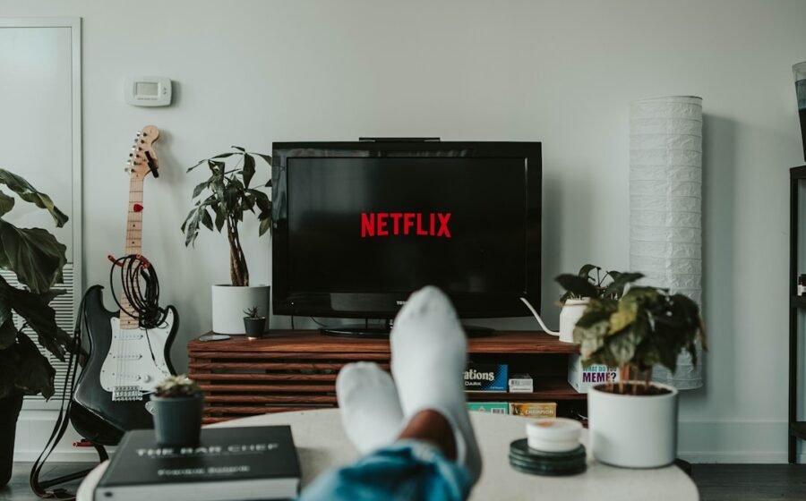 netflix viewing data - black flat screen tv turned on displaying 11