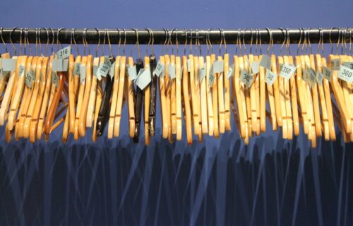 anti money laundering AML - brown wooden clothes hanger