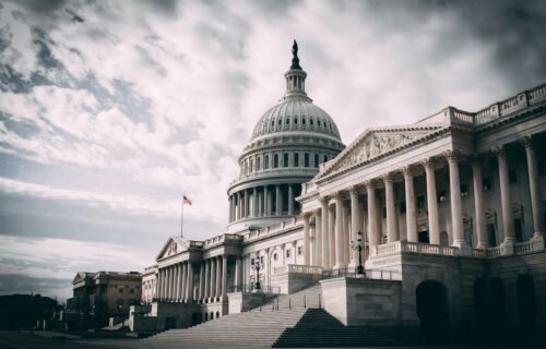 stablecoin rules deadline - white concrete building under cloudy sky during daytime