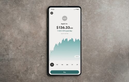 ai driving growth - a cell phone displaying a price on a concrete surface