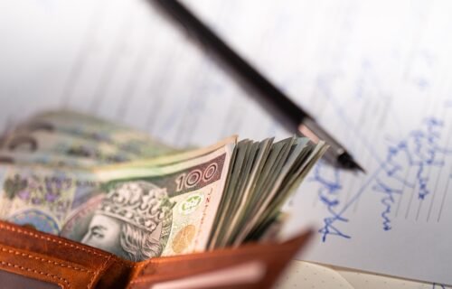 chime converts paychecks - Stack of polish zloty banknotes in a wallet.