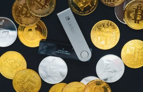 coldcard bitcoin loss - a close up of a bunch of gold coins