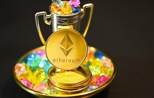 ethereum etf staking - a gold plate with a cup and some candy on it