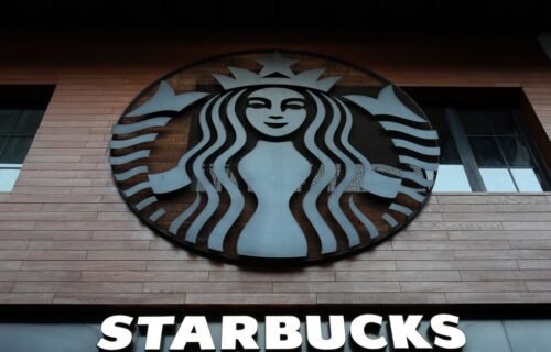 ftc settlement grubhub - Low angle shot of Starbucks building exterior with logo and windows.