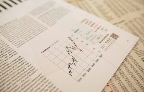 financial newspaper with stock chart