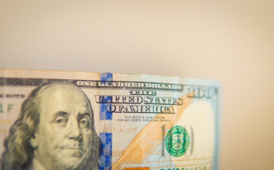 inflation eases july - Benjamin franklin on a one hundred dollar bill.