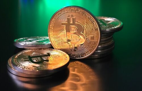 mica usdt europe - a pile of bitcoins sitting on top of a table