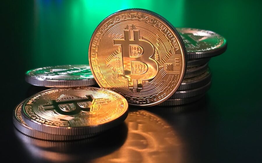 mica usdt europe - a pile of bitcoins sitting on top of a table