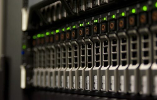 ai data center demand - Server rack with blinking green lights