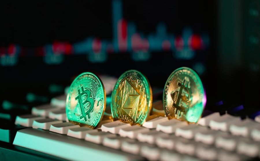 occ stablecoin reporting - Cryptocurrency coins sit on a keyboard.
