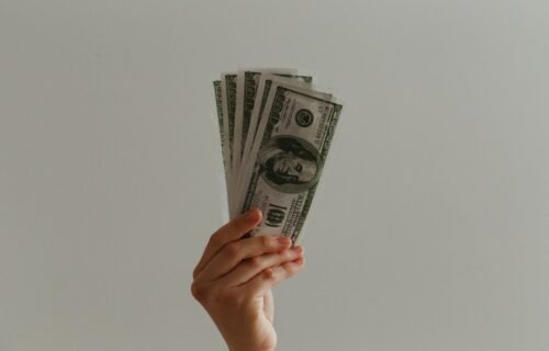 joe rogan earnings - 100 US dollar banknote