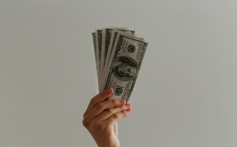 joe rogan earnings - 100 US dollar banknote