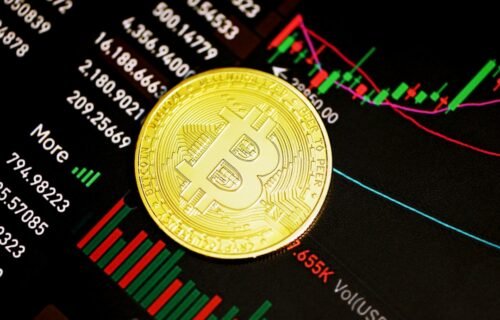 saylor sells btc - gold round coin on black surface