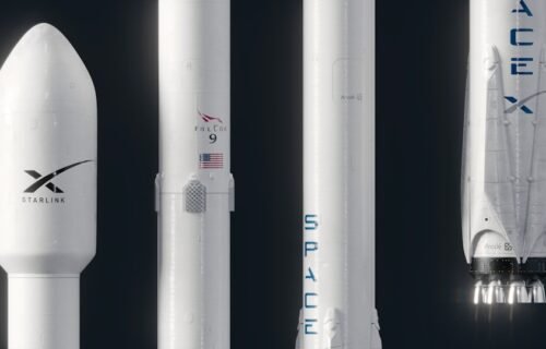spacex cursor acquisition - a model of a rocket with a smaller rocket next to it