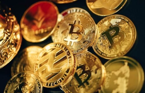 sec tokenized stocks - a pile of gold bitcoins sitting on top of each other