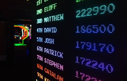 compliance & regtech moves rankings august 2026 - Colorful illuminated arcade scoreboard displaying high scores in a vibrant