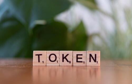 asset tokenisation blockchain - A wooden block that says token sitting on a table