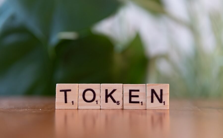 asset tokenisation blockchain - A wooden block that says token sitting on a table