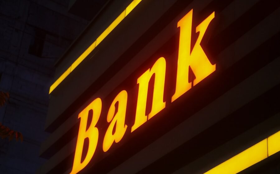 banking as a service BaaS - a bank sign lit up in the dark