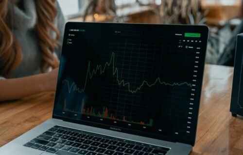 equity dilution startup - laptop showing stock chart on desk