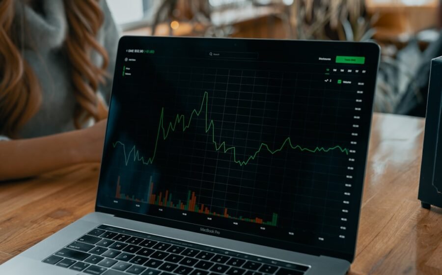 equity dilution startup - laptop showing stock chart on desk