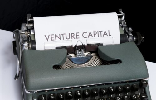 venture capital explained - green and white typewriter on black textile