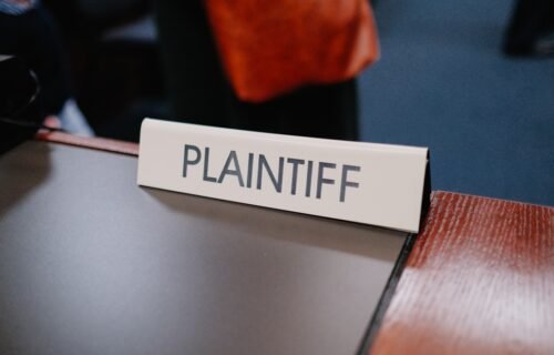 openai microsoft lawsuit - a close up of a sign on a table