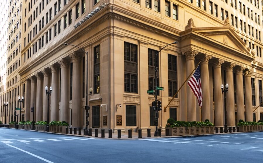 bitcoin nonfarm payrolls - a large building with columns and a flag on the corner
