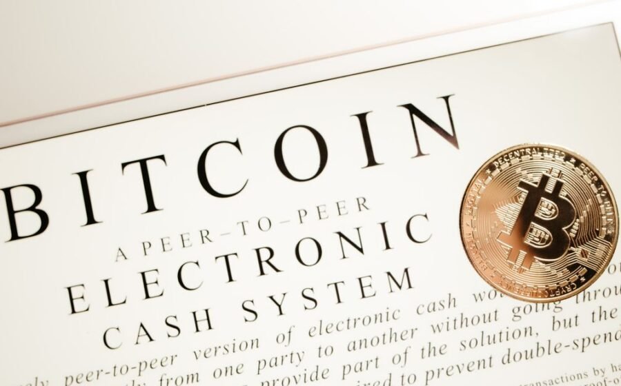 chainlink flying - Image depicting Bitcoin electronic cash system with a physical Bitcoin coin prominently displayed.