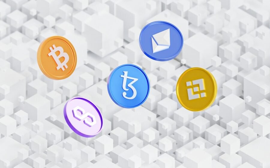 swift blockchain ledger - a group of colorful bitcoins sitting on top of a white background