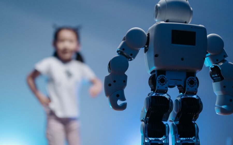 bytedance ai loan - A young girl playfully interacts with a humanoid robot in a futuristic indoor environment featuring soft
