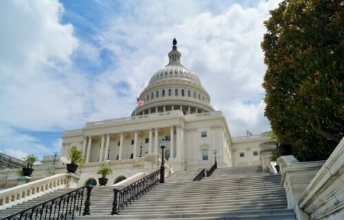 crypto bill senate - white concrete building under blue sky during daytime
