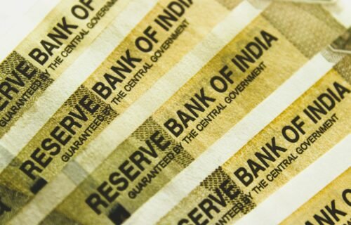fdic deposit rule - a stack of indian bank notes sitting on top of each other