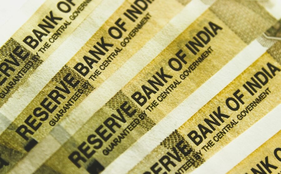 fdic deposit rule - a stack of indian bank notes sitting on top of each other
