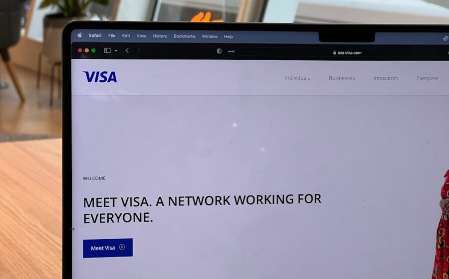 visa stablecoin programs - a computer screen with a window and a person in the background