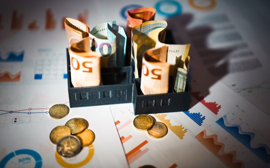 cfo forecast better - A pile of money sitting on top of a table