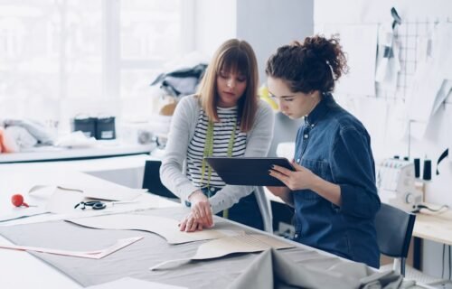 working capital management SME - Two fashion designers collaborating on a design