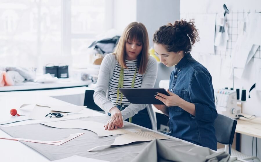 working capital management SME - Two fashion designers collaborating on a design